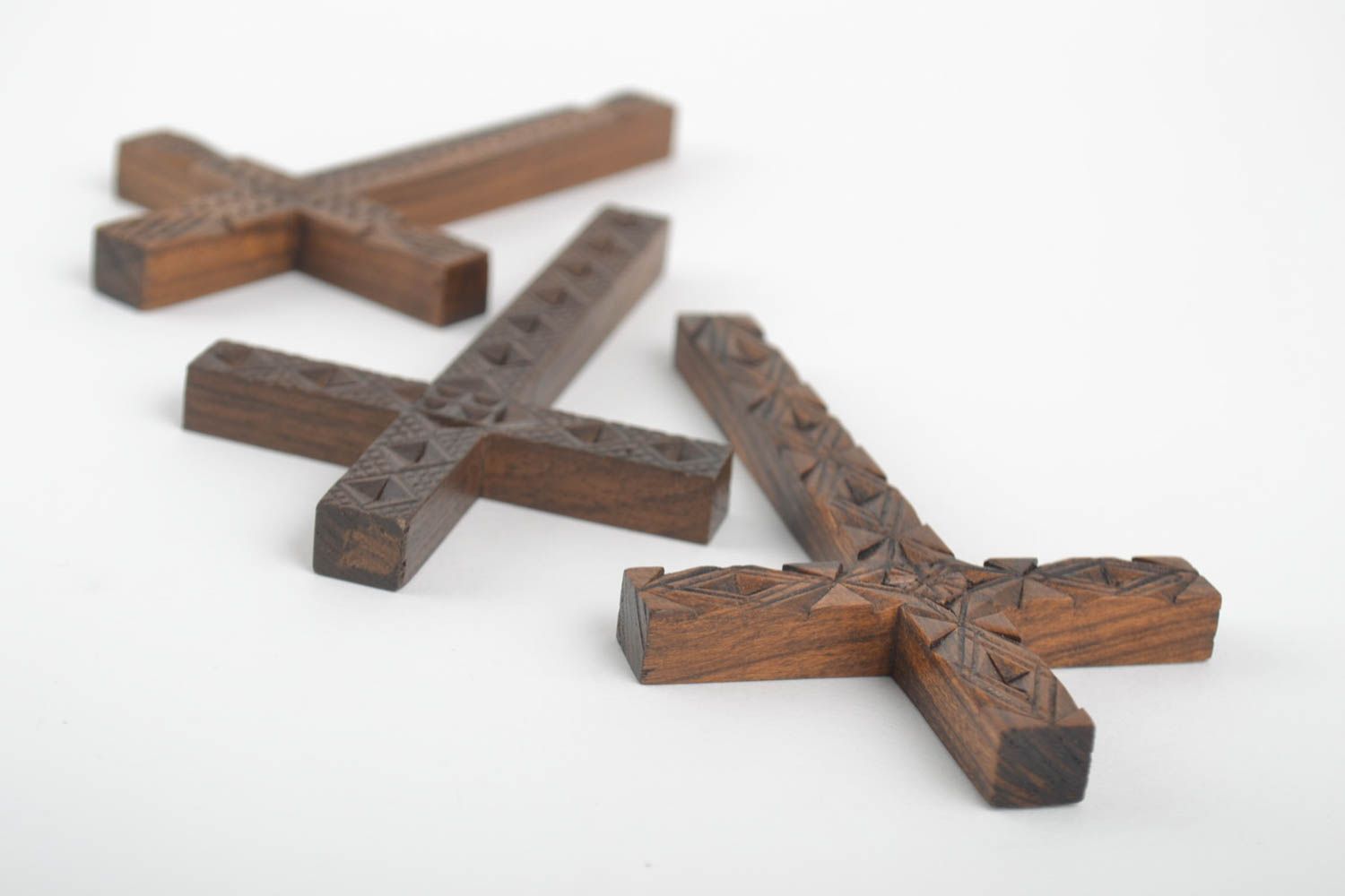 A set of three wooden crosses.