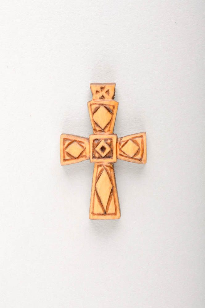 Cross pendant around the neck.