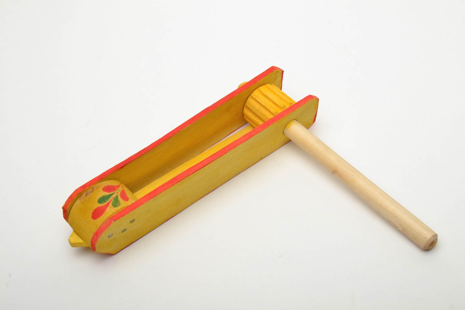 Handmade wooden rattle for children.