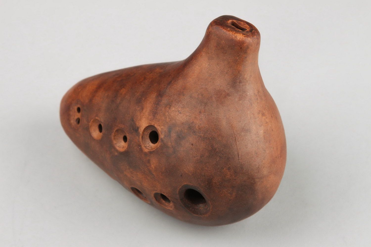 Ocarina, clay whistle flute with 8 holes.