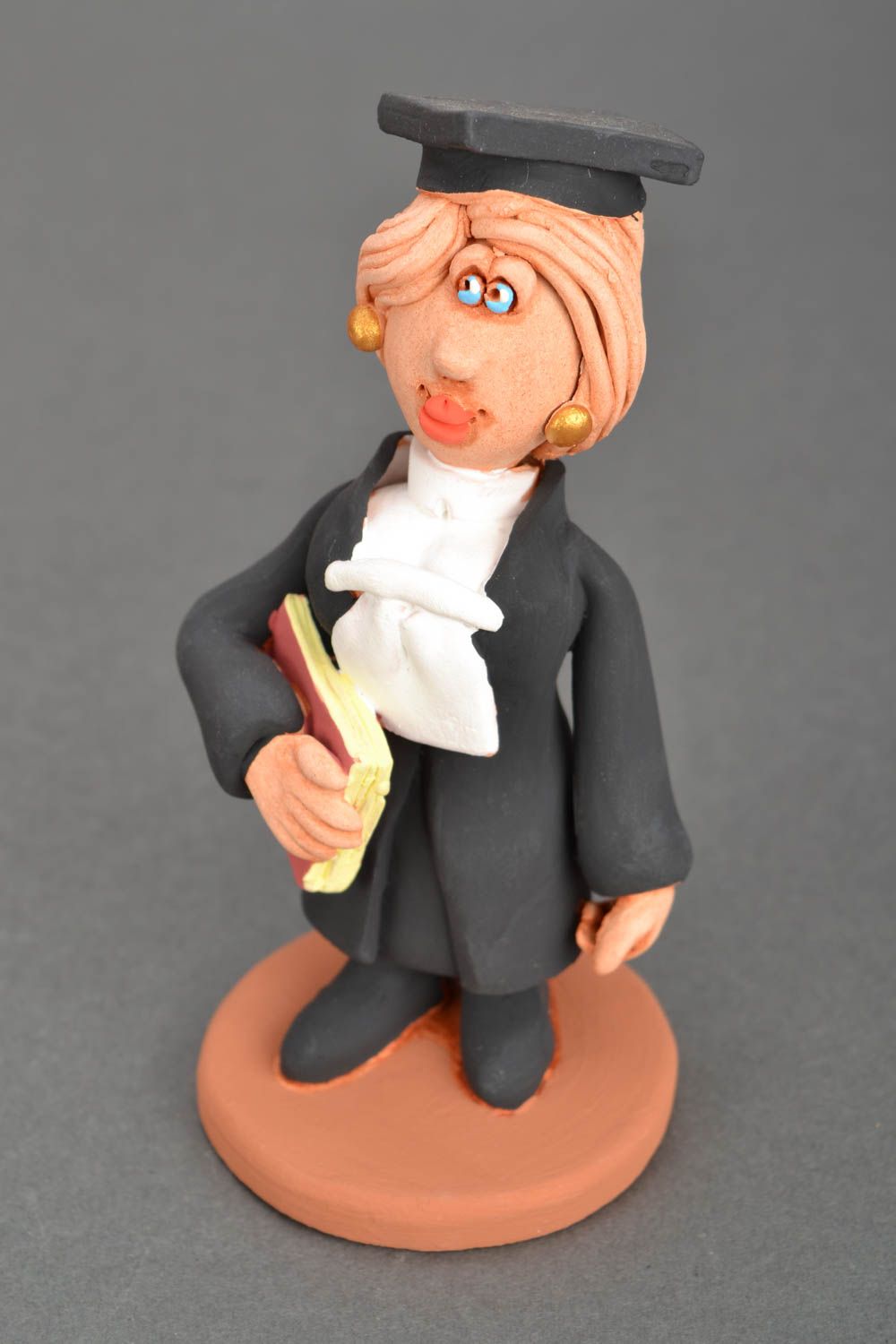 Clay statuette Woman judge.