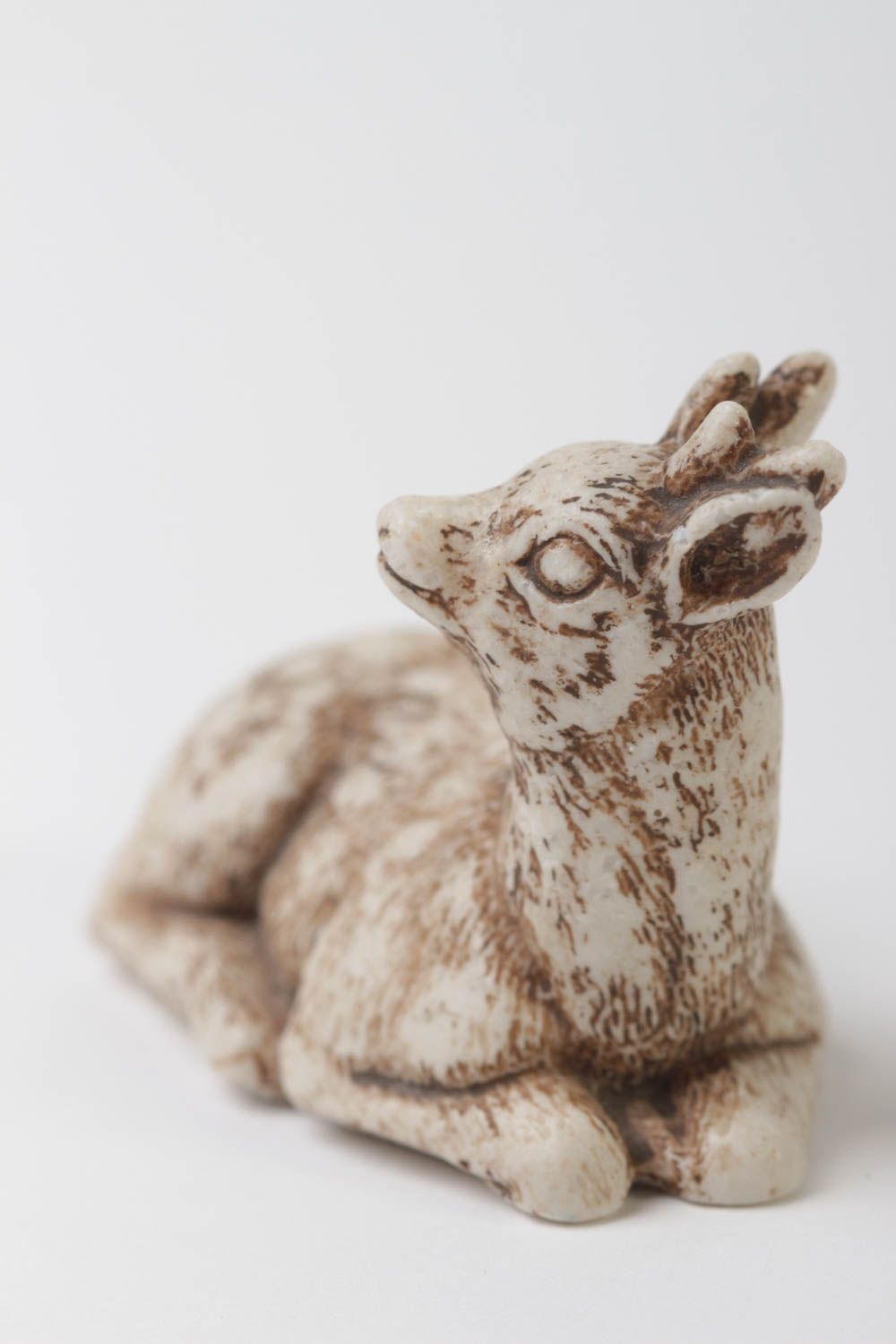 Small plastic resin deer figurine 