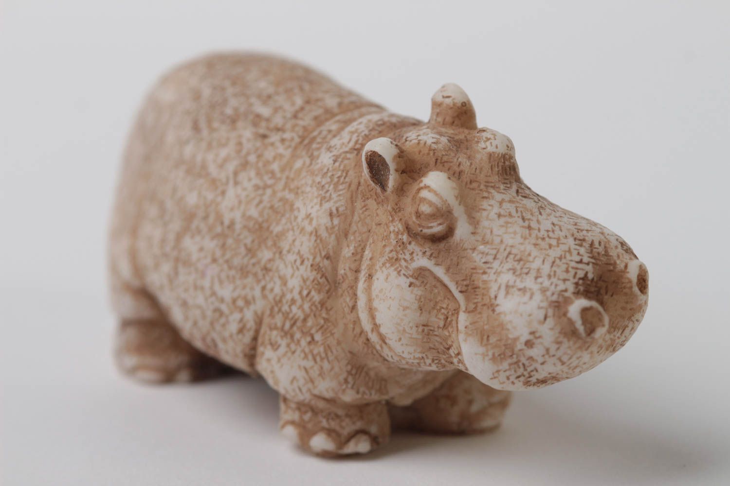 The hippopotamus figurine, made by hand.