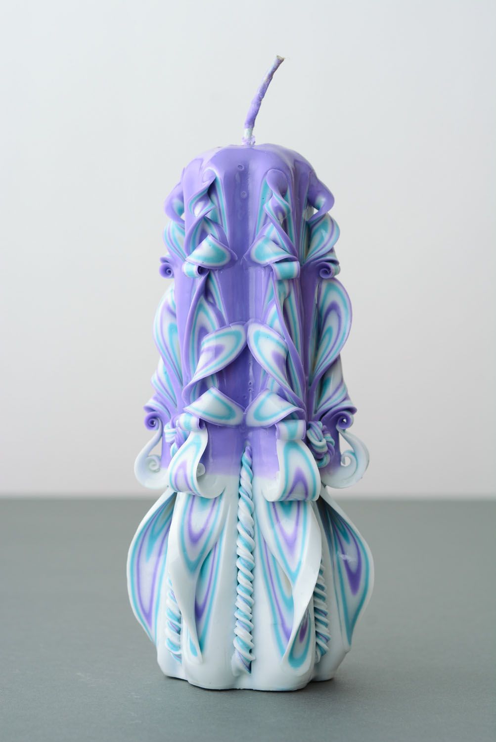 Large handmade carved paraffin candle.
