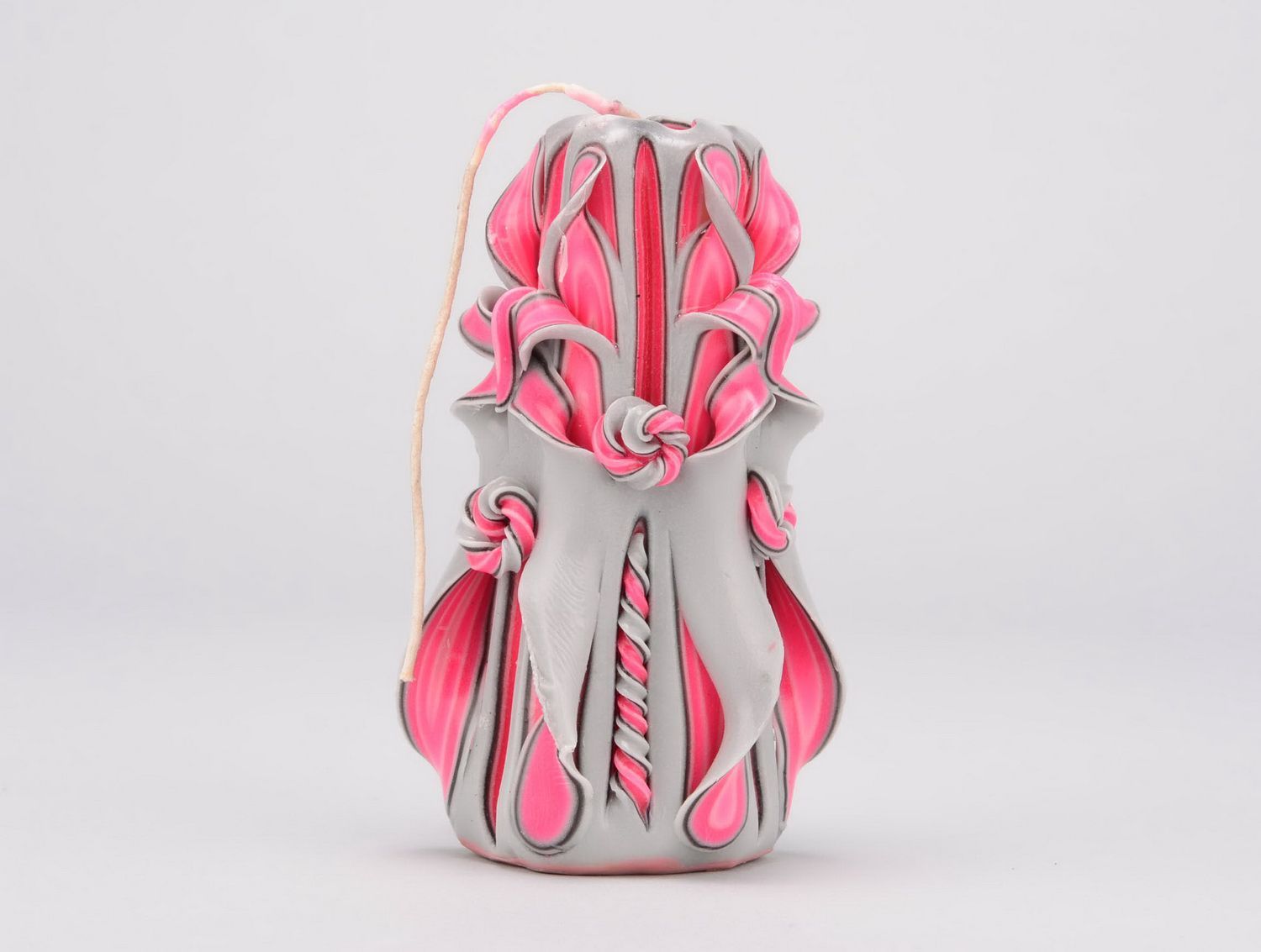 Carved candle in gray and pink shades