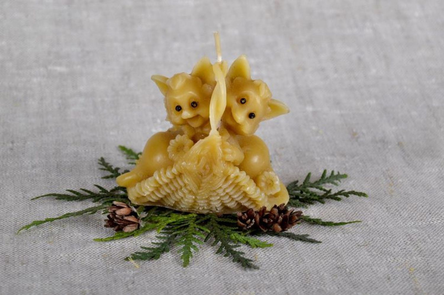 Candle made of natural wax and cotton in the form of 