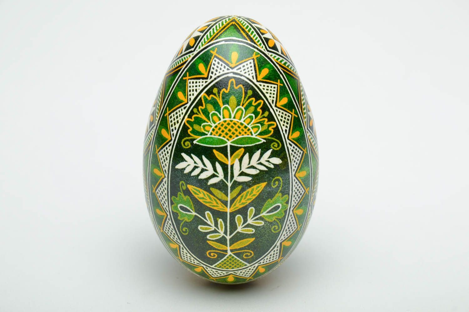 Pisanka in green shades based on goose egg.