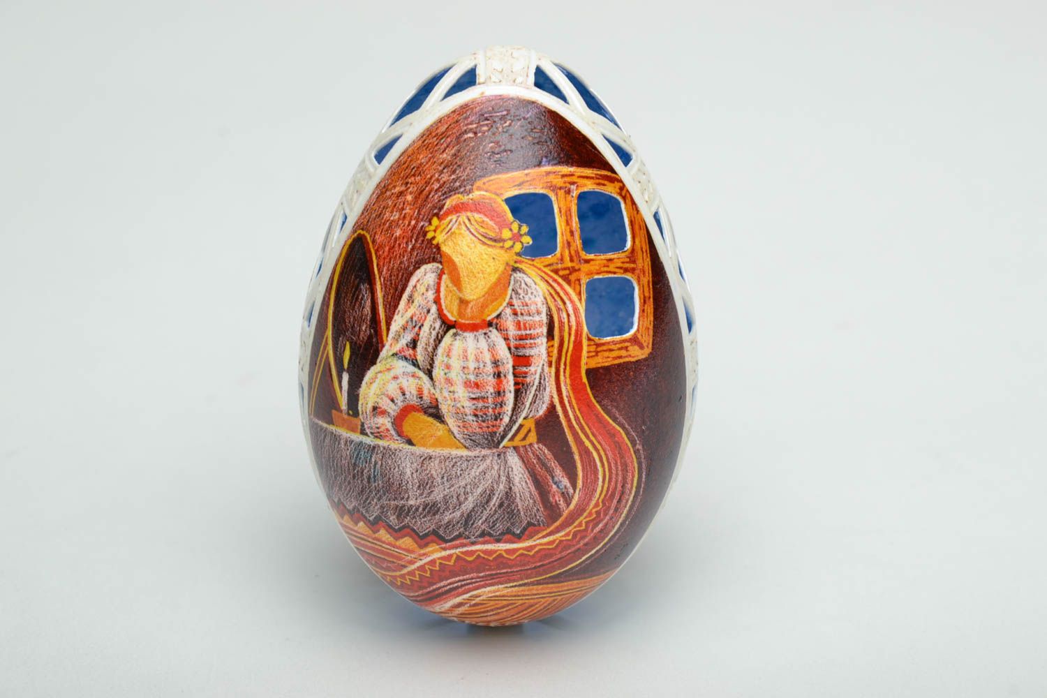 Handmade Easter egg with painting and perforation