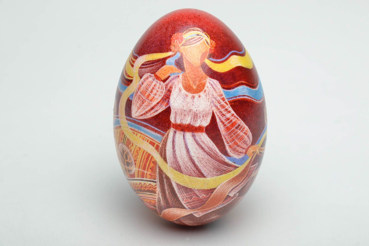 Decorative egg with the image of the Ukrainian girl for Easter, copyright.