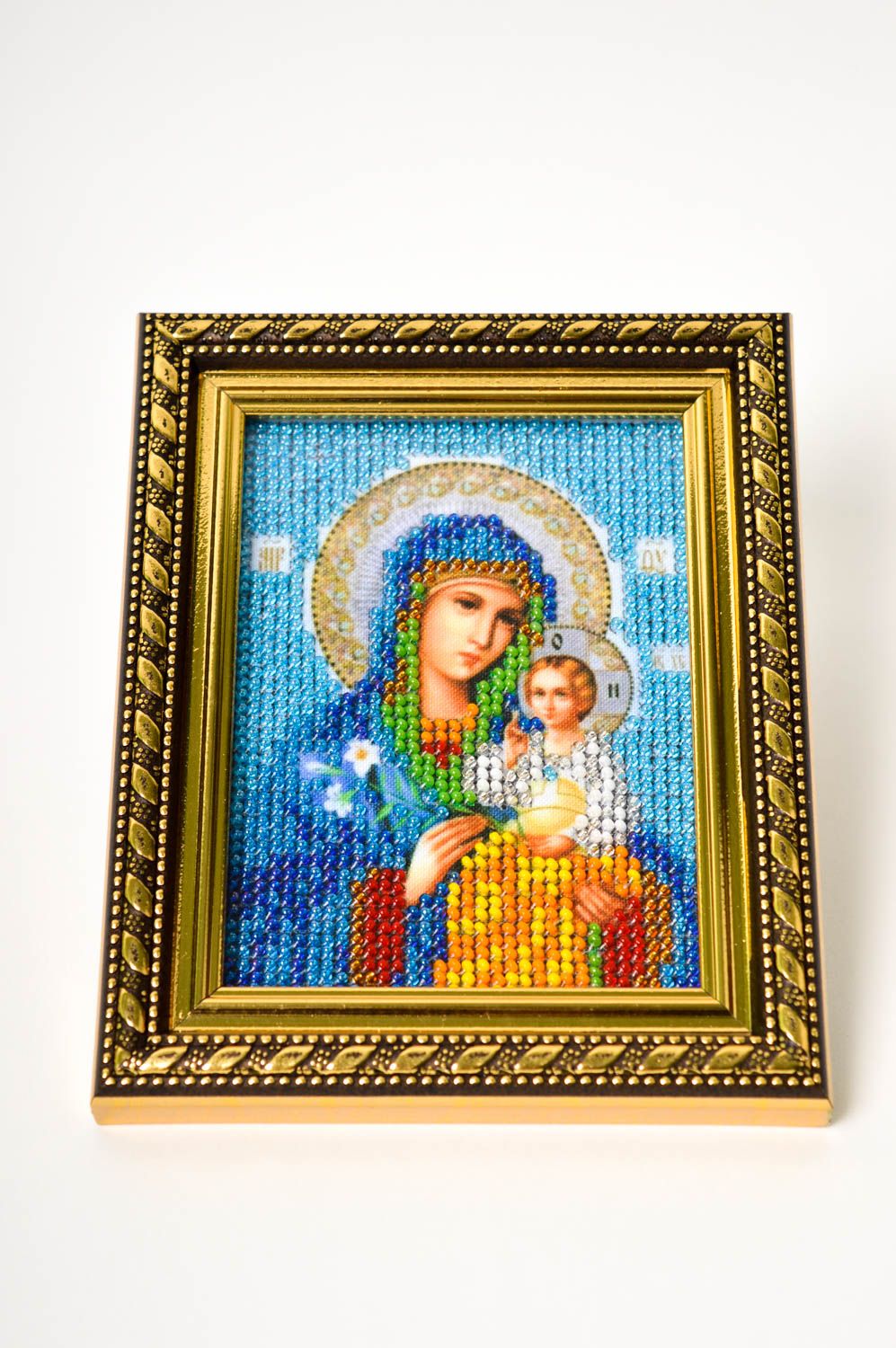 Hand embroidered icon with beads Invariable color.