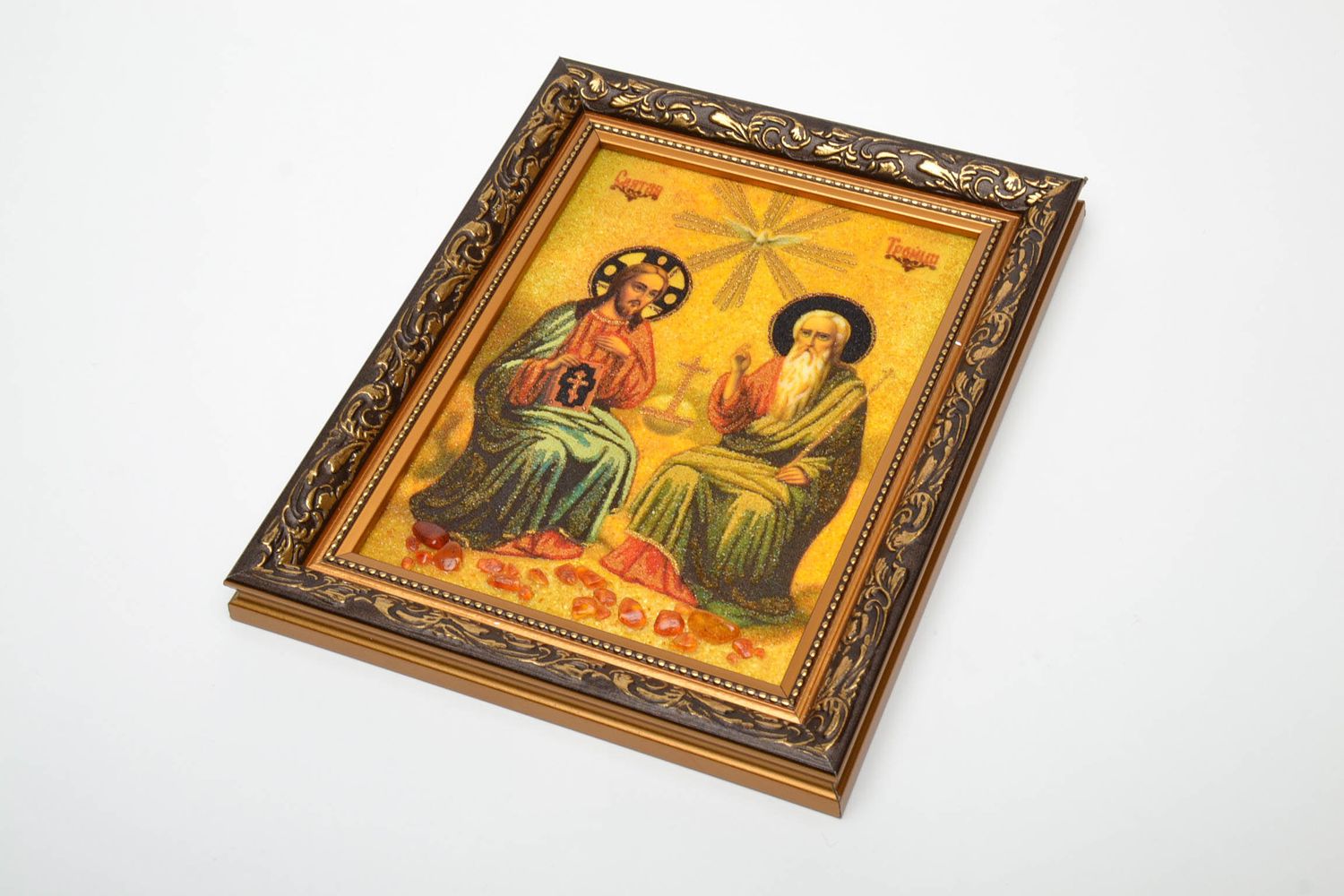 Orthodox icon of the Holy Trinity, with amber crumb. 