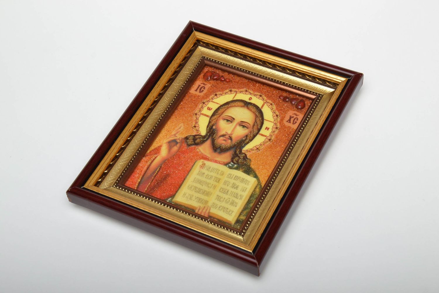 Reproduction of the icon of Jesus Christ, decorated with a crumb of natural stone. Handmade.