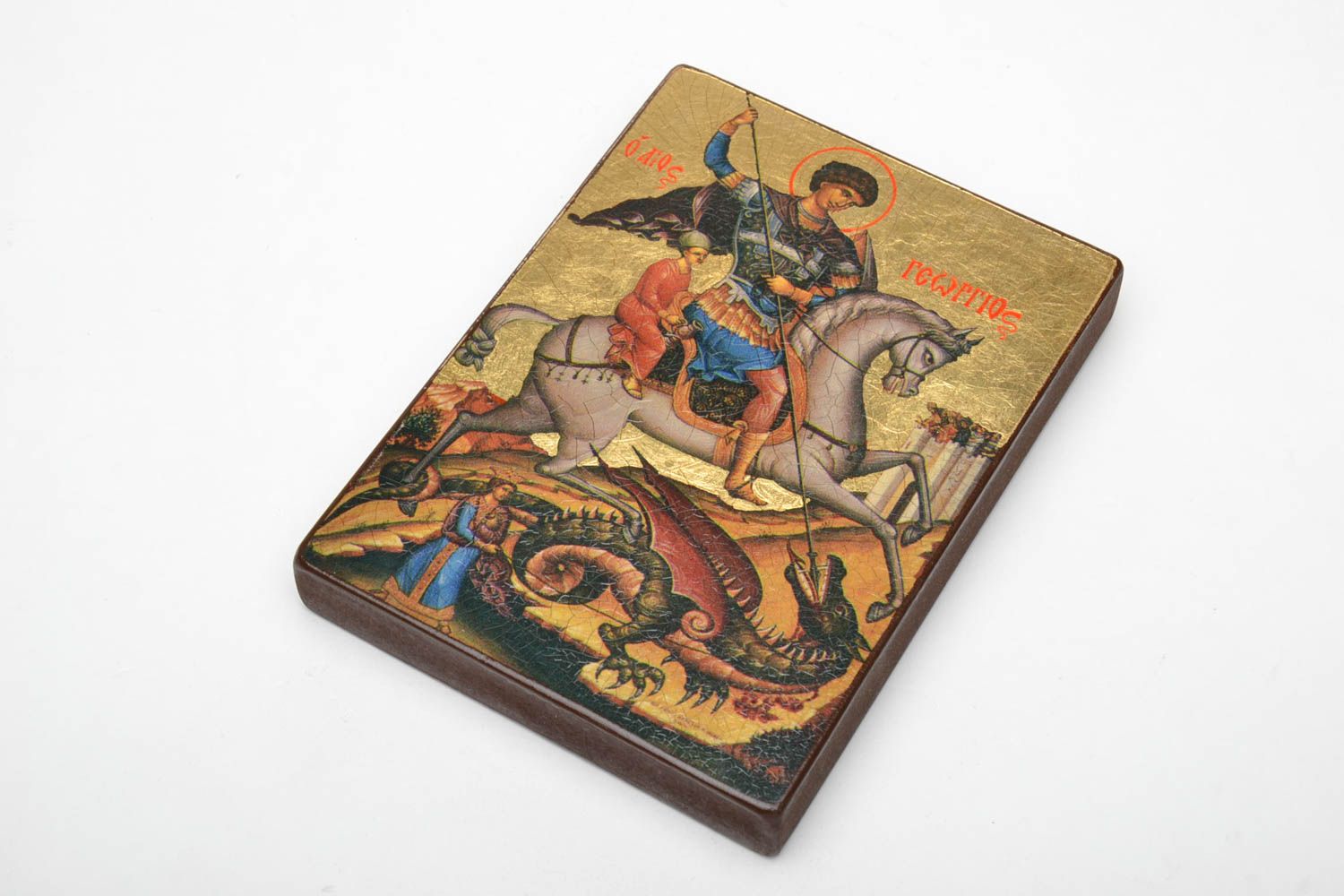 Reproduction of the icon of St. George the Victorious on a wooden base.