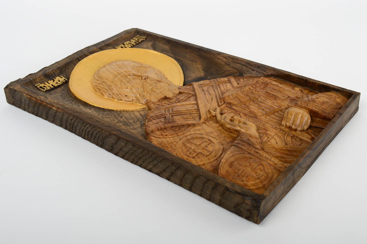 Carved icon of St. Nicholas of natural wood, painted with acrylic paints.